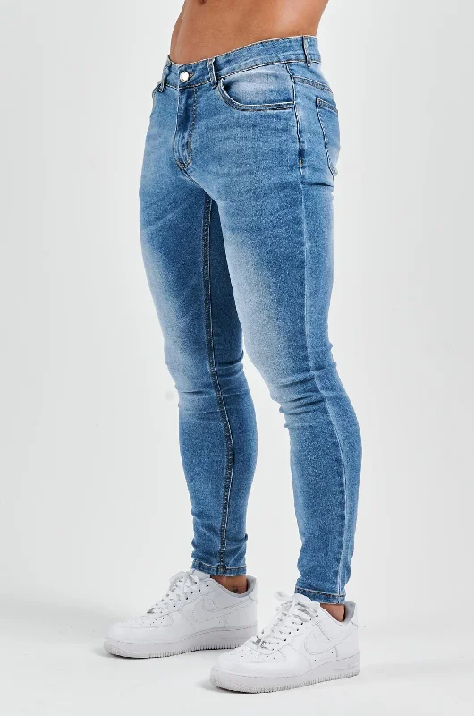 Men's Distressed Jeans with Patches for a Retro and DIY - Inspired AppearanceSKINNY FIT JEANS - LIGHT BLUE WASH
